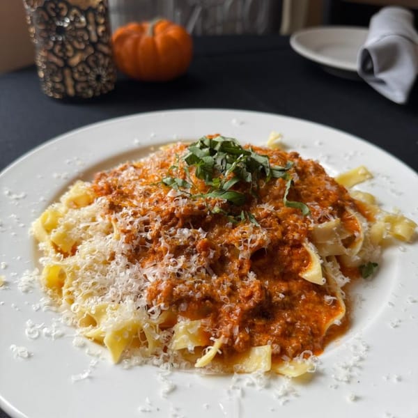 Marrelli's Italian Restaurant's pappardelle pasta with bolognese sauce, parmesan cheese, and fresh basil.